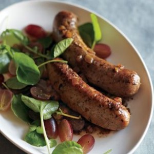 Balsamic-Braised Sausages with Grapes and Watercress