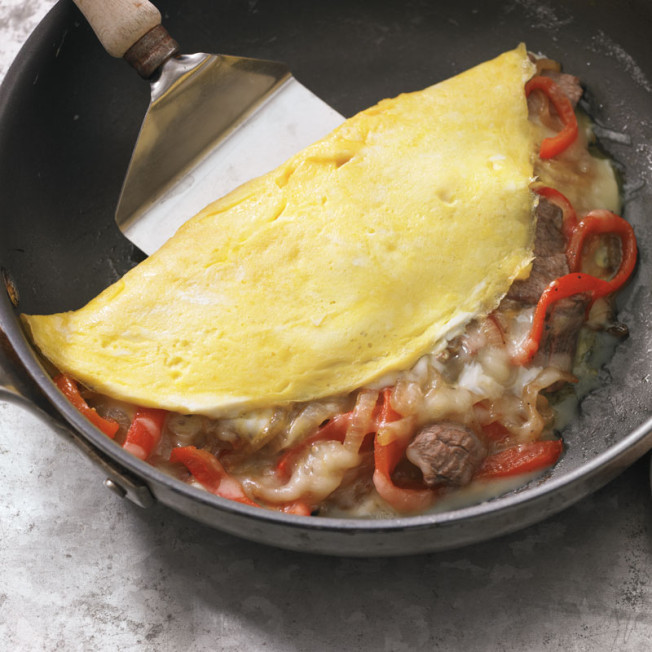 Philly Cheesesteak Omelet with Onions and Bell Peppers