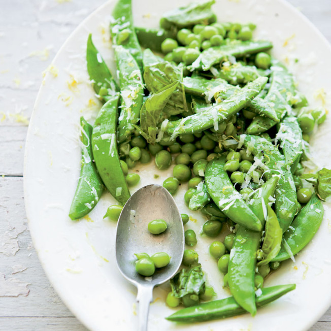 A speedy sauté brings out the natural sweetness and enhances the crunch of two kinds of spring peas, which are reaching their peak at most farmers’ market this month. Anise-like fresh basil, tart lemon zest and tangy pecorino cheese are sprinkled on top for a delicious, fresh and fast side dish. Sautéed Garden Peas with Basil and Pecorino 1 Tbs. unsalted butter 1 Tbs. olive oil 1/2 lb. (250 g) sugar snap peas, trimmed 1 lb. (500 g) English peas, shelled Sea salt and freshly ground pepper 1 lemon Leaves from 4 fresh basil sprigs, torn into pieces About 1 oz. (30 g) chunk pecorino romano cheese In a large fry pan over medium heat, melt the butter with the olive oil. Add the sugar snap peas and English peas. Pour in 1/4 cup (2 fl. oz./60 ml) water and add a pinch of salt. Cover and cook for 2 minutes. Uncover and cook, stirring occasionally, until the water has evaporated, about 2 minutes longer. The peas should be crisp-tender and still bright green. Finely grate 2 tsp. zest from the lemon, then halve the lemon. Remove the pan from the heat and squeeze the juice from 1 lemon half over the peas (reserve the remaining half for another use). Add the lemon zest, basil and a pinch each of salt and pepper to the pan. Grate cheese over the top to taste and stir to mix well. Transfer the peas to a warmed serving dish and serve immediately. Serves 4. Good for you