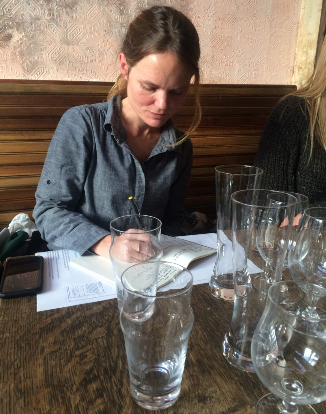 Glassware designer Alexia Chimenti taking diligent notes on pint glasses.