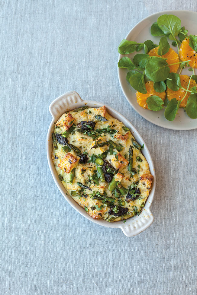 Savory bread pudding with spring vegetables and herbs